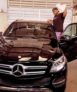 Sina Rambo shows off his sleek new Mercedes Benz car